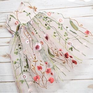 Flower girl embroidered dress in white tulle.